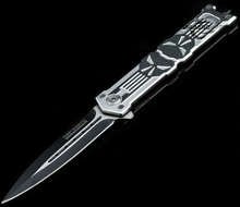 photo of a steel pocket knife on a black background