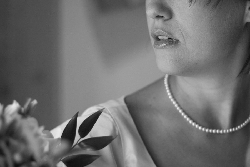 black and white photo of the bride’s neck and shoulder