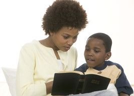 mom and child are reading a book as a picture for a clipart