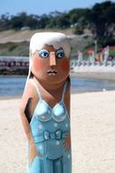 Statue of woman on a coast