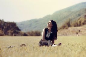 woman relaxing on a field