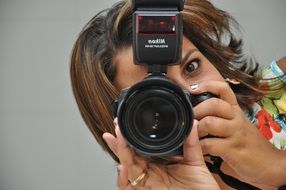Photographer girl is taking photo of herself