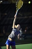 girl tennis player is taking part in tennis set