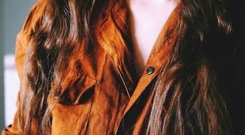 brown suede blouse on a woman