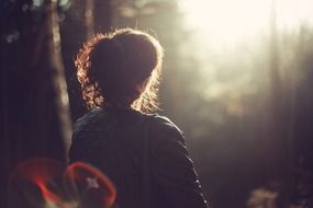 thoughtful woman sitting outdoor