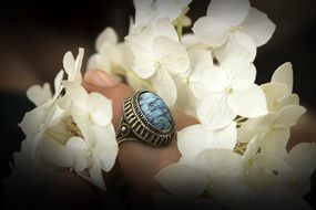 flowers and blue ring