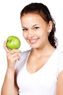 smiling girl with a green apple in hand