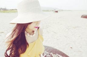 girl is resting on a beach