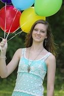 young woman with colorful balloons