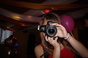 girl with a camera at a party