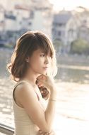 asian woman in the sunset sunlight