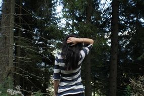 photo brunette on the background of the forest