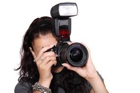 female holding digital camera equipment