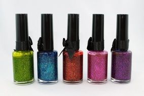 colorful nail polish with glitters