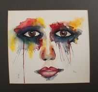 multi-colored picture in the form of a female face