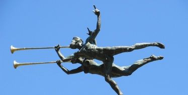 trumpeters, bronze sculpture at sky