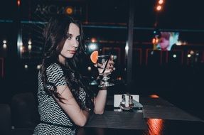 Girl with a cocktail in hand