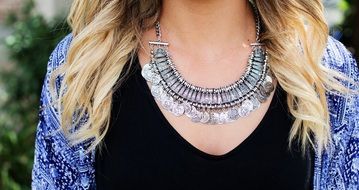 Silver jewelry on female neck