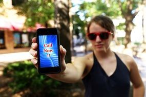 woman with cell phone in hand