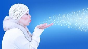 woman in a white fur coat blows off snowflakes