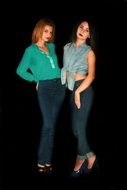 Photo of Two beauty girls in a dark