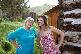 mother and daughter among nature in the village