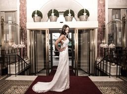 girl in a wedding dress on the red carpet