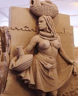 sand sculpture of woman