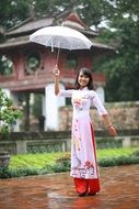 Photo of Asian girl under umbrella