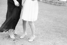 two women in elegant dresses