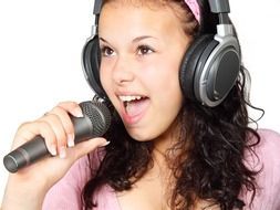 Girl singing karaoke with the microphone