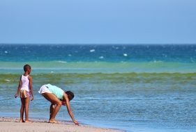 woman and child on beach