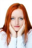 a girl with a thin face and bright red hair