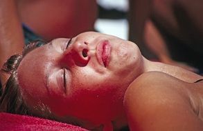 young woman sunbathes