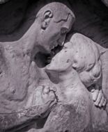 stone sculpture of a couple in love