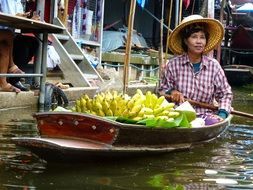 woman on boat as vendor in thailand