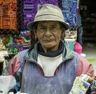 old woman sells souvenirs in peru