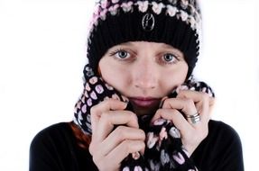 young female model in winter hat and scarf