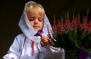 girl in traditional peasant clothes with flowers