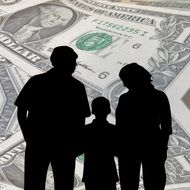 silhouette of a family on a background of dollars