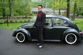 Male standing near the 1966 vw beetle