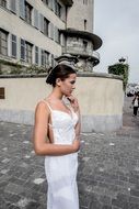 young woman in wedding dress outdoor