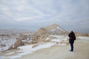 girl in the frozen mountains in Cappadocia, Turkey