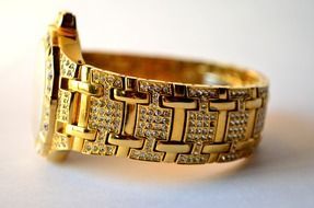 luxury wrist watch, gold with jewellery band, macro