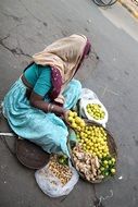 street vendor, woman selling fruits, india, new delhi