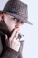smoking young man in a hat