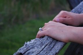 hands with engagement ring closeup