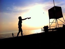 woman silhouette on the beach