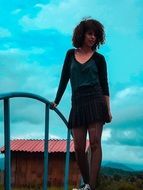 curly woman on the bridge