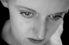 Black and white photo of the pensive girl's face